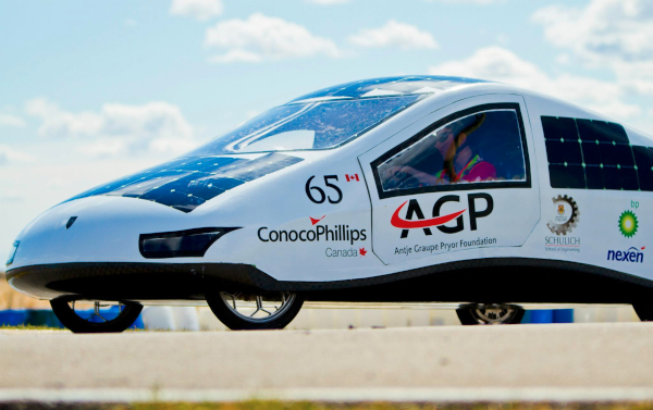 the solar car from an angle with a driver inside